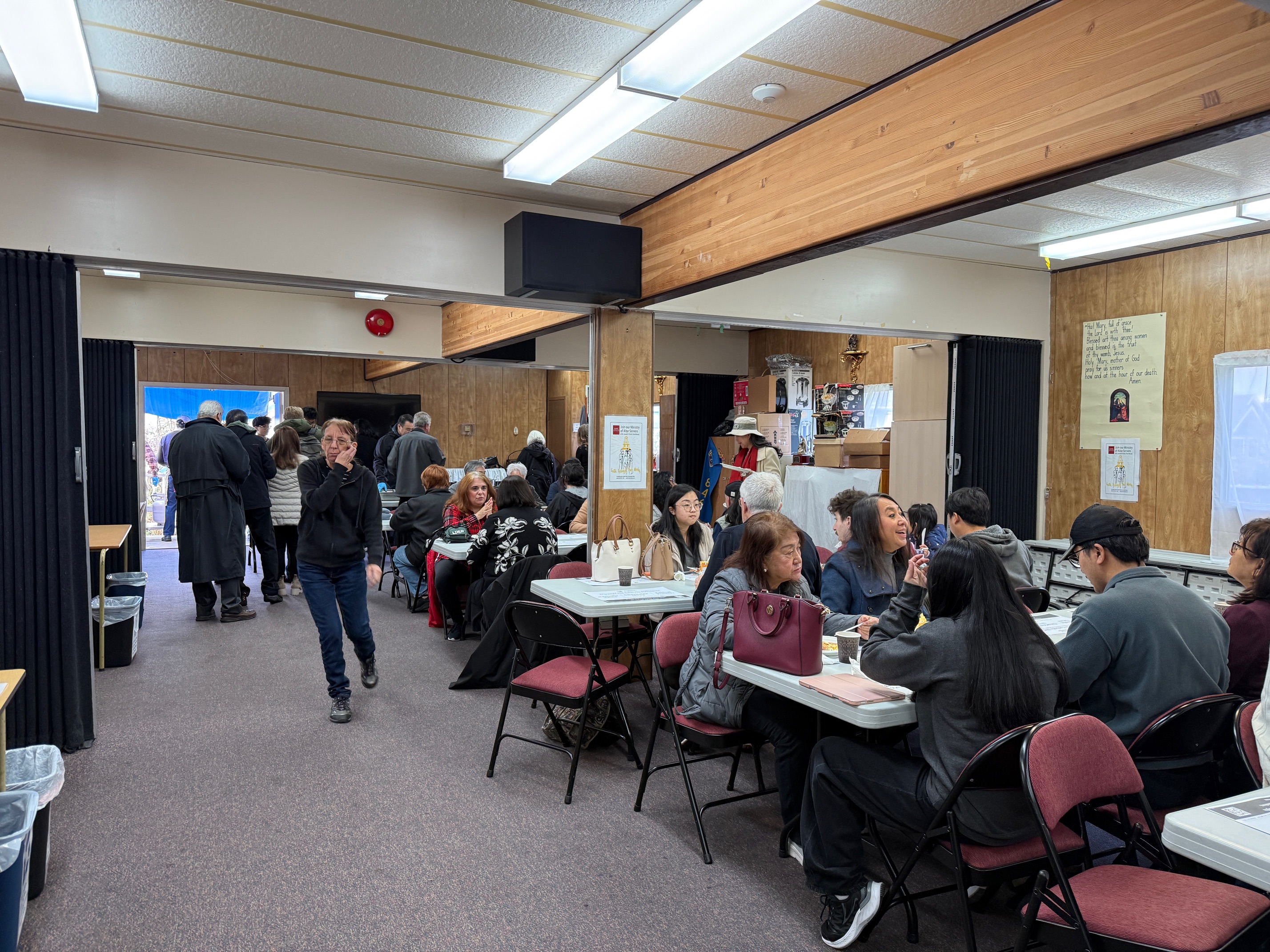 Parishioners filling the portable and sharing breakfast together