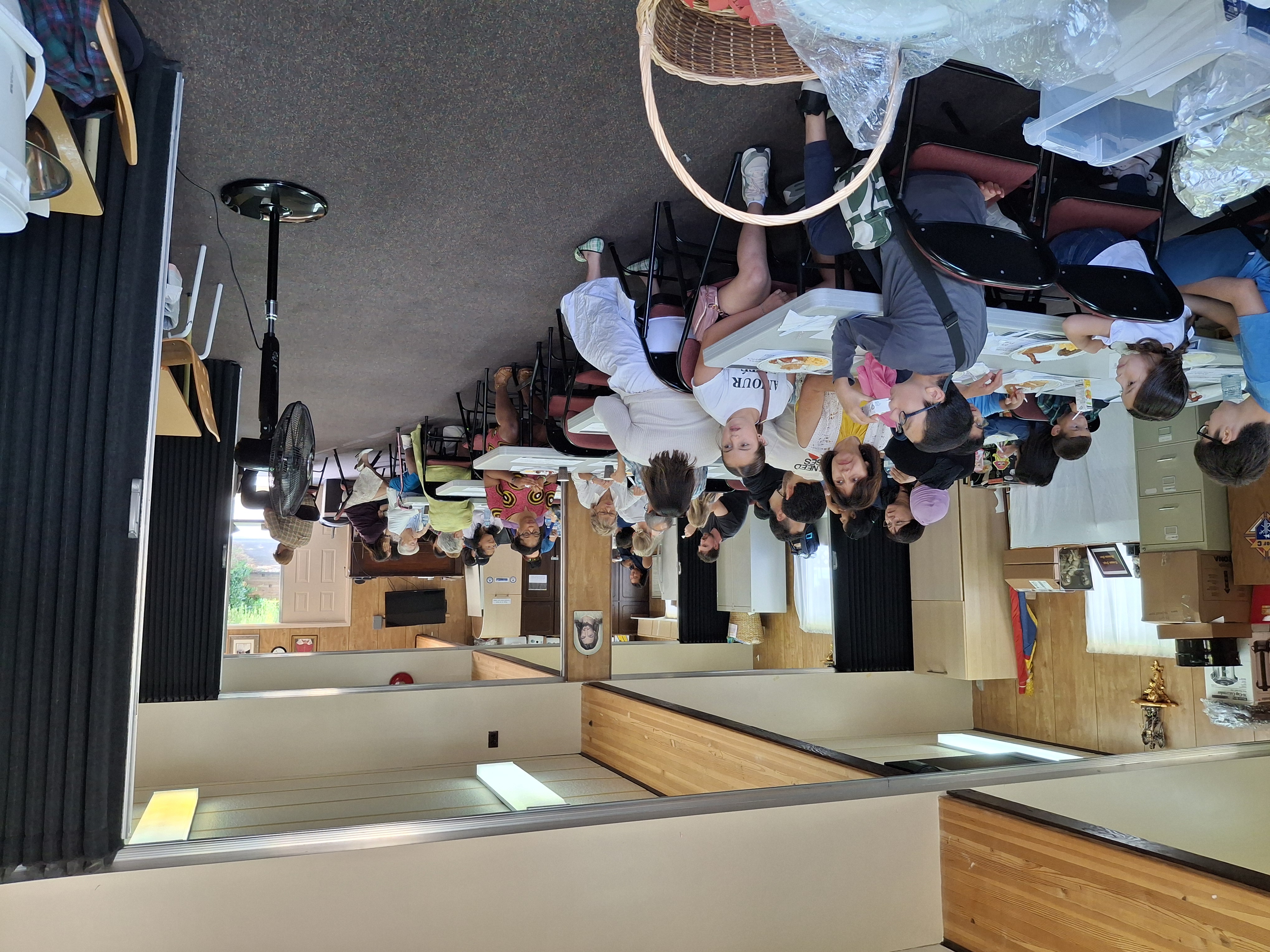 Parishioners enjoying breakfast together in the portable