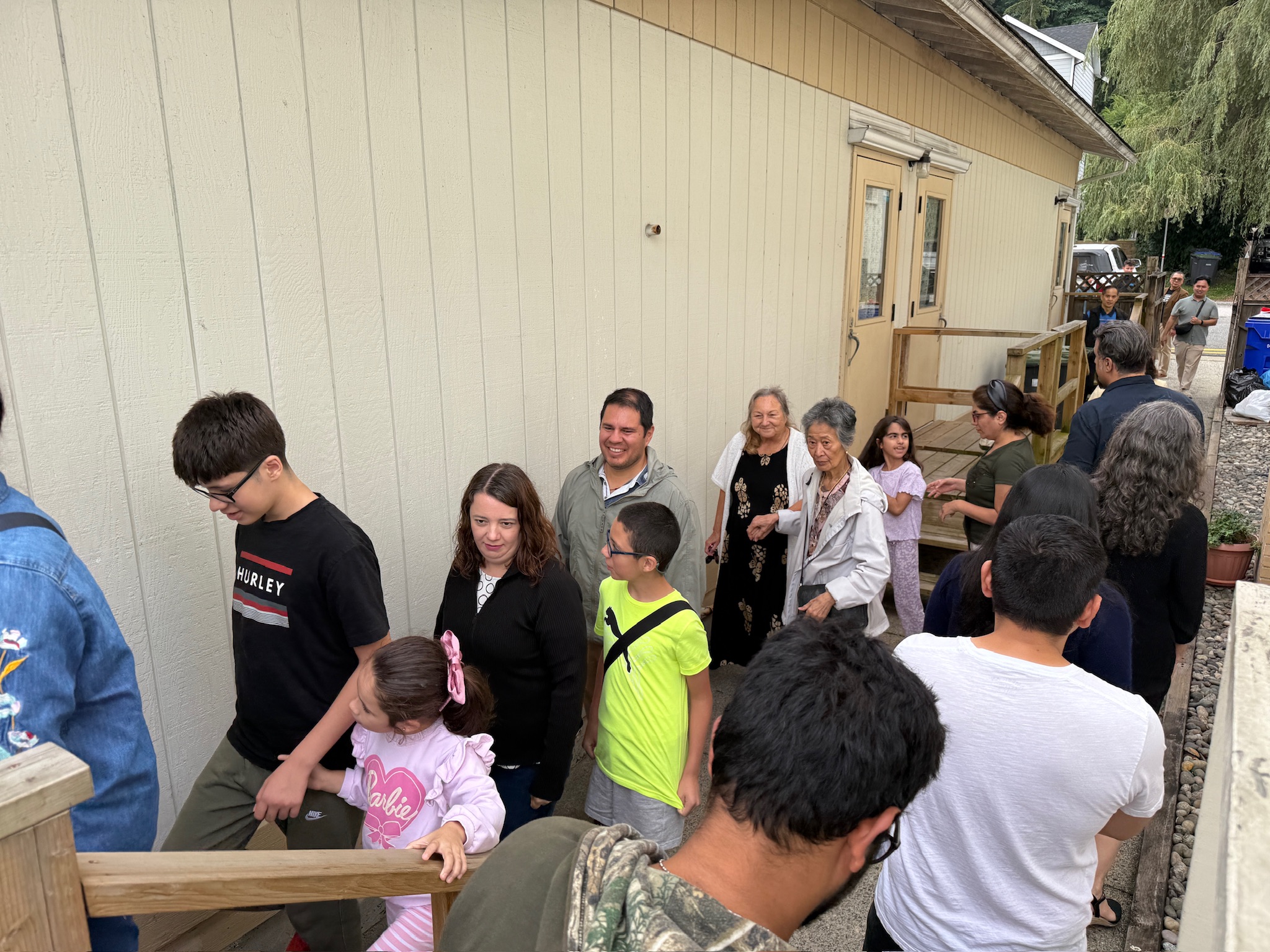 Parishioners lining up at the portable for picnic lunch