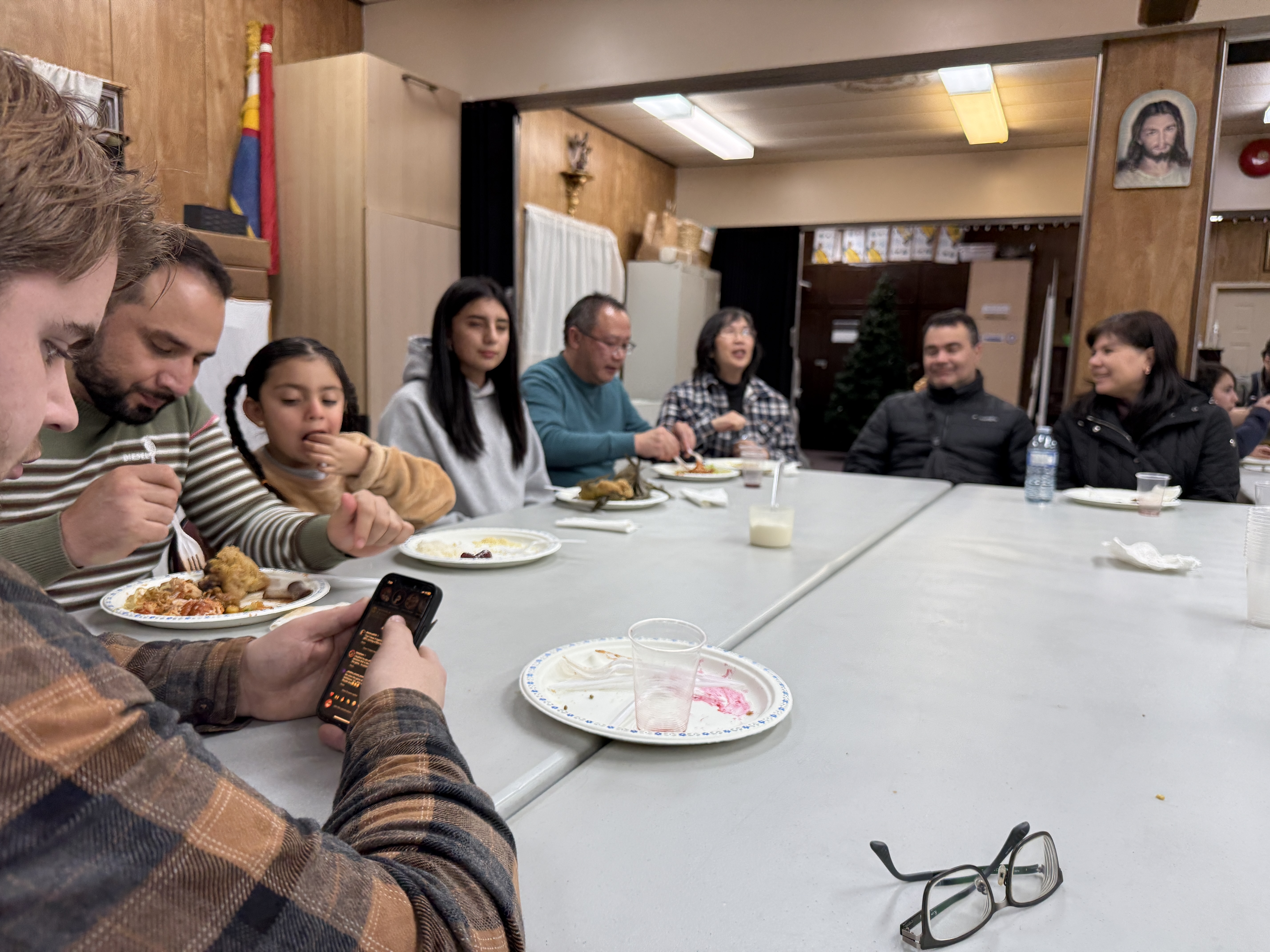 Families sharing a meal together at the Christmas party